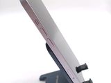 a close up of a cell phone on a stand