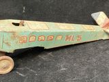 a toy airplane that is sitting on a black surface