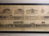 an old drawing of a ship on display in a black frame