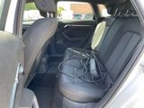 the back seat of a car with a power cord in it