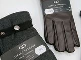 three pairs of gloves that are sitting on a table