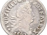 a close up of a coin on a white background