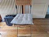 a chair that is sitting on the floor in front of a radiator