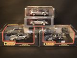 three toy cars that are sitting on top of each other