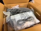 a cardboard box with a bag of clothing inside of it
