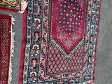 many rugs on the floor on the floor
