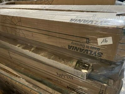 several stacks of cardboard boxes stacked on top of each other in a warehouse