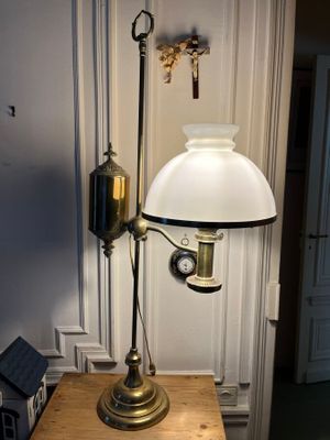 a lamp that is on top of a wooden table