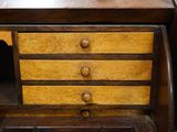 a wooden desk with a drawer on top of it