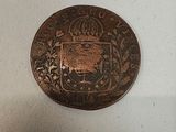 an old coin with a coat of arms and a crown on it