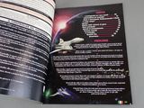 an open book with a picture of a space shuttle on it