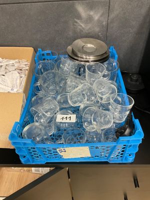 bottles of water are in a plastic container on a table