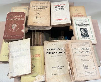 many old books stacked on top of each other on a table