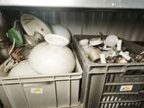 two bins that are filled with dirty dishes