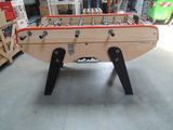 a foosball table in the middle of a room