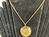 a close up of a necklace on a mannequin display