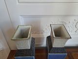 two blue and white vases sitting on the floor