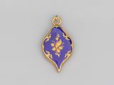 un pendentif bleu et or orné d'un motif floral