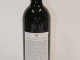 a bottle of wine that is sitting on a table
