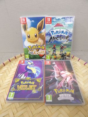 a couple of nintendo wii games sitting on top of a table