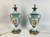 pair of blue and gold vases with flowers and birds on them