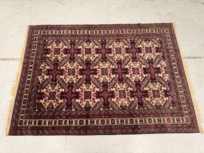 rug on the floor in a room with a white floor and a white floor
