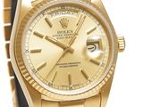 an image of a gold rolex watch with roman numerals
