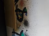 a painting on the wall of a room with a television