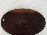 a wooden sign that is hanging on a wall