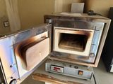 an open oven that is sitting on a table