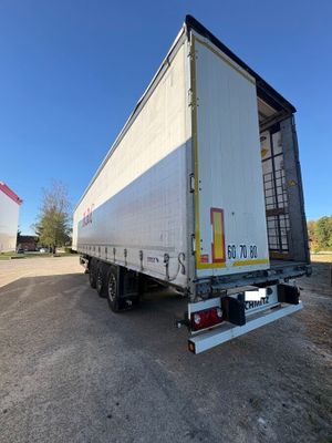 a semi truck that is parked on the side of the road