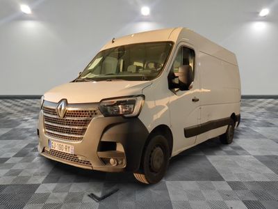 a white van that is parked on a checkered floor