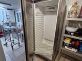an image of a refrigerator in a kitchen with a door open