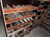 many boxes of screws and nuts on the shelves