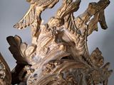a statue of a bird with a crown on it ' s head