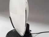 a white light that is on top of a black base