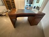 an image of a wooden desk in a room