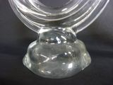 a glass candle holder with a candle inside of it