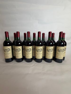 six bottles of red wine lined up in a row