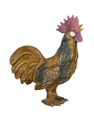 une figurine représentant un coq sur fond blanc