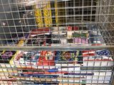 a metal cart with many items in it in a warehouse