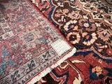 many different rugs on the floor in this room