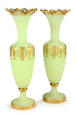 pair of green and gold vases on a white background