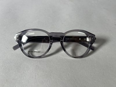 the glasses are made of plastic and have a clear lens