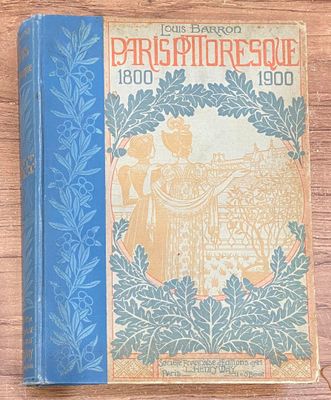 un livre bleu sur lequel figure la photo d'un homme et d'une femme