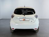 a white car that is parked in a room