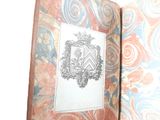 a book with a picture of a coat of arms on it