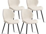 set of four white dining chairs with black legs