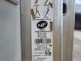 a close up of a parking meter with a sticker on it