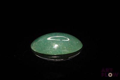 a picture of a green and white object in the dark